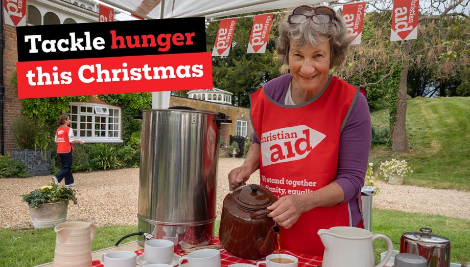 Fundraiser pouring tea at event